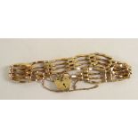 9CT GOLD FOUR BAR GATE BRACELET WITH HEART SHAPED PADLOCK, 7.1 grams.