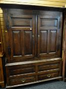 18TH CENTURY JOINED OAK LIVERY CUPBOARD, frieze carved 1726, iron strap handles to the paneled