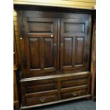 18TH CENTURY JOINED OAK LIVERY CUPBOARD, frieze carved 1726, iron strap handles to the paneled