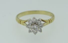18CT DIAMOND FLOWER HEAD CLUSTER RING, centre diamond surrounded by eight smaller, 2.6grams