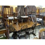 DARK STAINED OAK ERCOL DINING SUITE of trestle table and six dining chairs