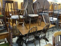 DARK STAINED OAK ERCOL DINING SUITE of trestle table and six dining chairs