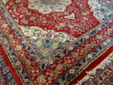 TABRIZ STYLE RUG having blue and ivory medallions and spandrels to a field, multiple guards and