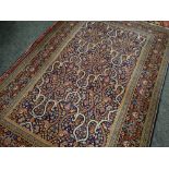 PERSIAN GARDEN RUG with indigo field, stylized flowers, arabesque compartments, lotus border,