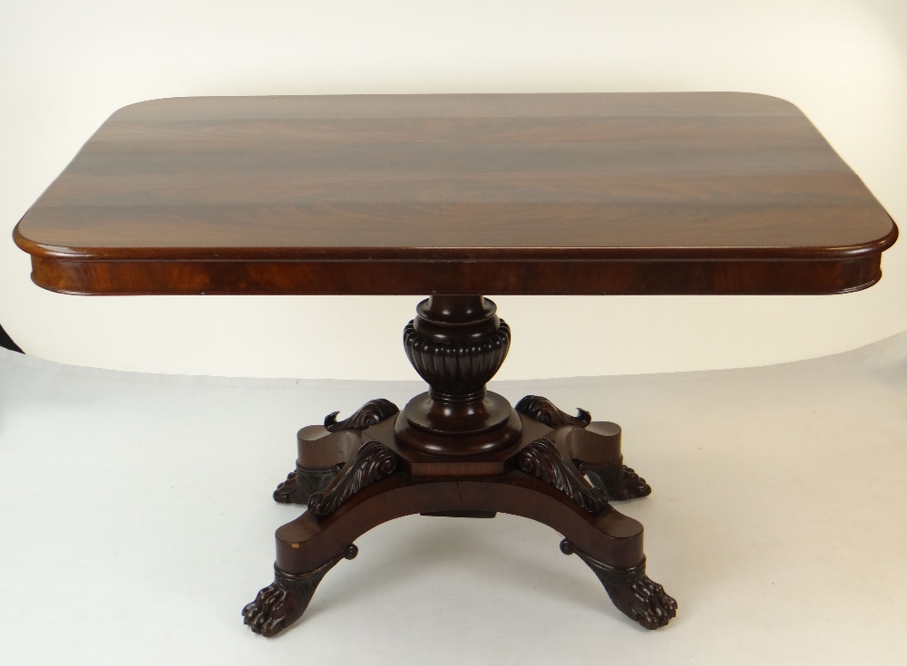 WILLIAM IV FLAME MAHOGANY BREAKFAST TABLE, rectangular tilt action top, on elaborate carved column