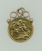 VICTORIAN GOLD SOVEREIGN DATED 1889 with yellow metal scroll mount, 9.0 grams overall.