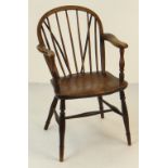 19TH CENTURY ELM WINDSOR ARMCHAIR with spindle back and turned legs