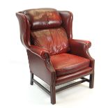 GEORGIAN STYLE LEATHER UPHOLSTERED WING-BACK ARMCHAIR