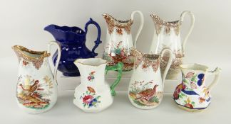 WELSH POTTERY JUGS four Cambrian brown printed jugs, sporting birds, three other Welsh jugs, one