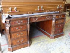 GEORGE II STYLE MAHOGANY PARTNERS DESK having a top laid with leather, arrangement of drawers and