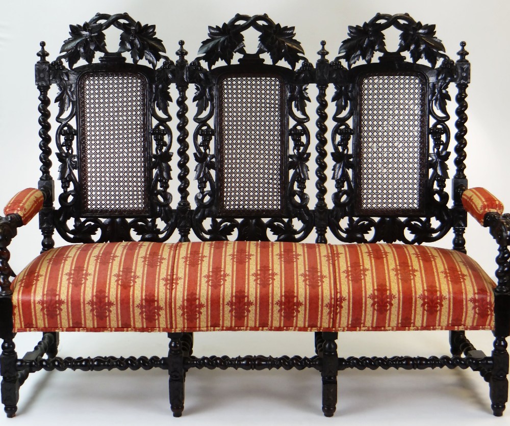 CAROLEAN STYLE CARVED OAK & CANED TRIPLE BACK SETTEE, 166cms wide