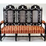 CAROLEAN STYLE CARVED OAK & CANED TRIPLE BACK SETTEE, 166cms wide