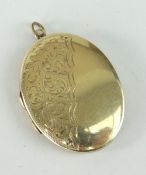 9CT YELLOW GOLD OVAL LOCKET, scroll engraved, 12.5gms
