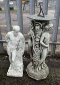 TWO GARDEN ORNAMENTS including a figural sun dial, 80cms high, and a figure of Hercules