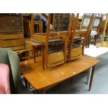 MID CENTURY TEAK EXTENDING DINING TABLE & FOUR CHAIRS together with a rectangular coffee table en