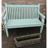 GREEN SLATTED GARDEN BENCH, makers label behind, 1 meter 20cms, and an Art Nouveau style stone