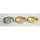 9CT YELLOW GOLD ENGRAVED BANGLE (21.1 grams), 9ct gold metal core bangle and a silver bangle of belt