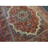 FOUR ASIAN RUGS including a Tabriz style rug, largest 333 x 251cms (4)