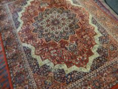 FOUR ASIAN RUGS including a Tabriz style rug, largest 333 x 251cms (4)