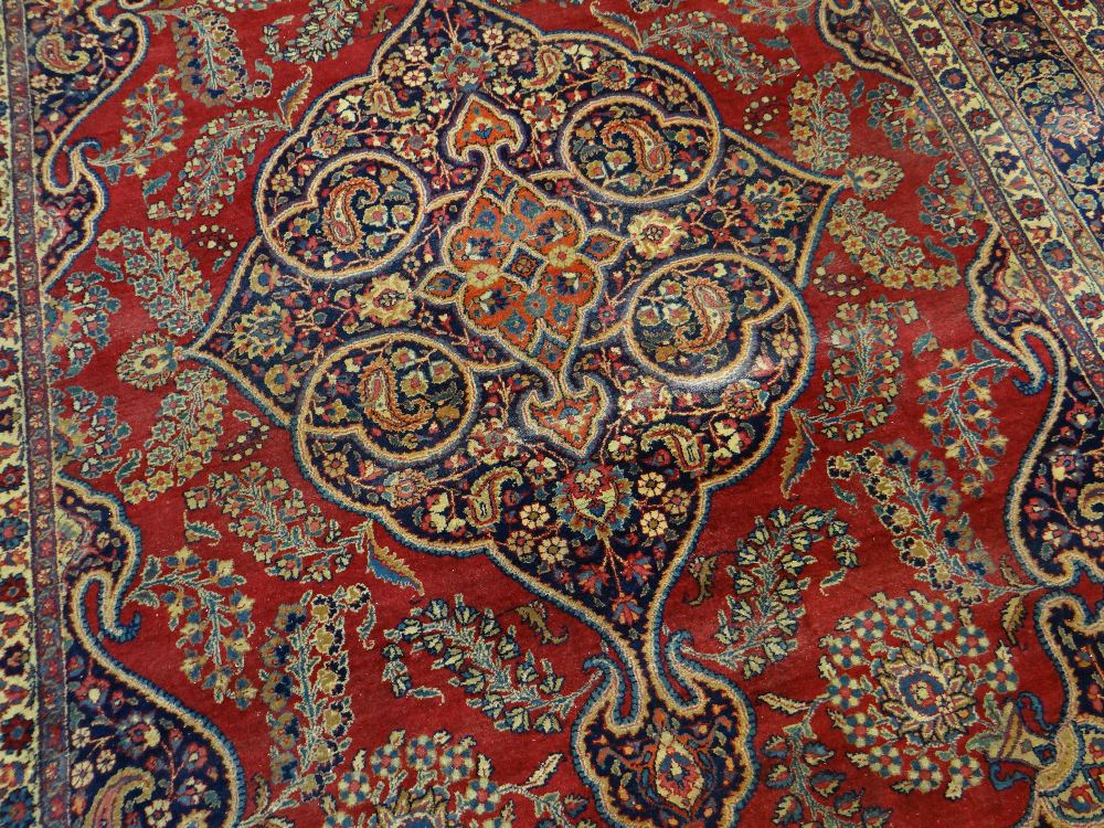 TABRIZ RUG with blue arabesque medallion and spandrels on red palmette ground, multiple borders - Image 2 of 3