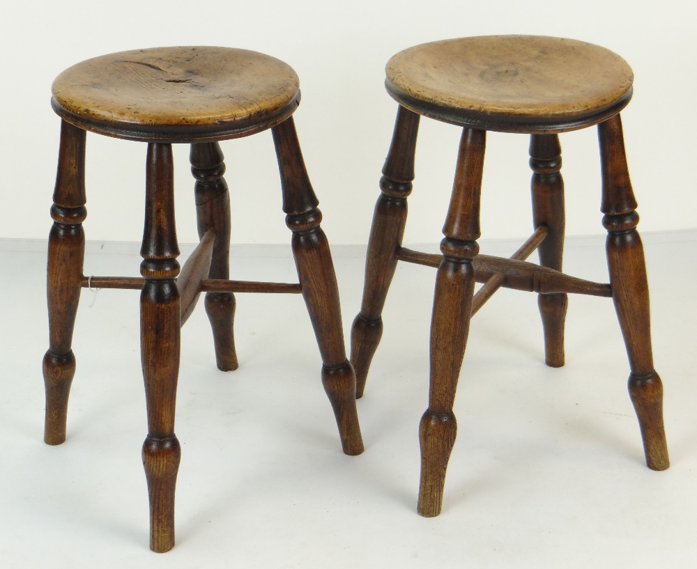 PAIR OF 19TH CENTURY TURNED BEECH & ELM FOOT STOOLS, 51cms high (2)