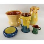 FIVE EWENNY POTTERY ITEMS including two three handled vases, cream jug, flared vase, circular