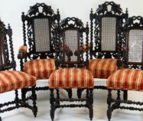 SET OF EIGHT CAROLEAN STYLE CARVED OAK & CANED DINING CHAIRS, including two armchairs