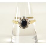 18CT YELLOW GOLD (750) DIAMOND CHIP AND SAPPHIRE CLUSTER RING, 3.4 grams.