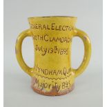 MUSTARD GLAZED EWENNY POTTERY TWIN-HANDLED MUG inscribed 'General Election, South Glamorgan, July