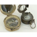 TWO ENGLISH BRASS MILITARY COMPASSES, one by Stanley of London mark 1941 for The Navy, the other