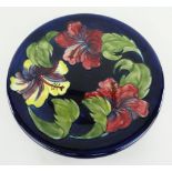 MOORCROFT POTTERY BLUE GROUND CHARGER, Hibiscus pattern, 31cms diameter