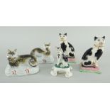 VICTORIAN CAT MODELS, pair of Staffordshire recumbent cats, two seated on cushions and a porcelain