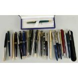 ASSORTED WRITING INSTRUMENTS including five Parker fountain pens, six Parker ball point pens, rolled
