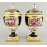 PAIR OF COPELAND'S SPODE CHINA URNS & COVERS painted with flowers by J Worrall, 20cms high (