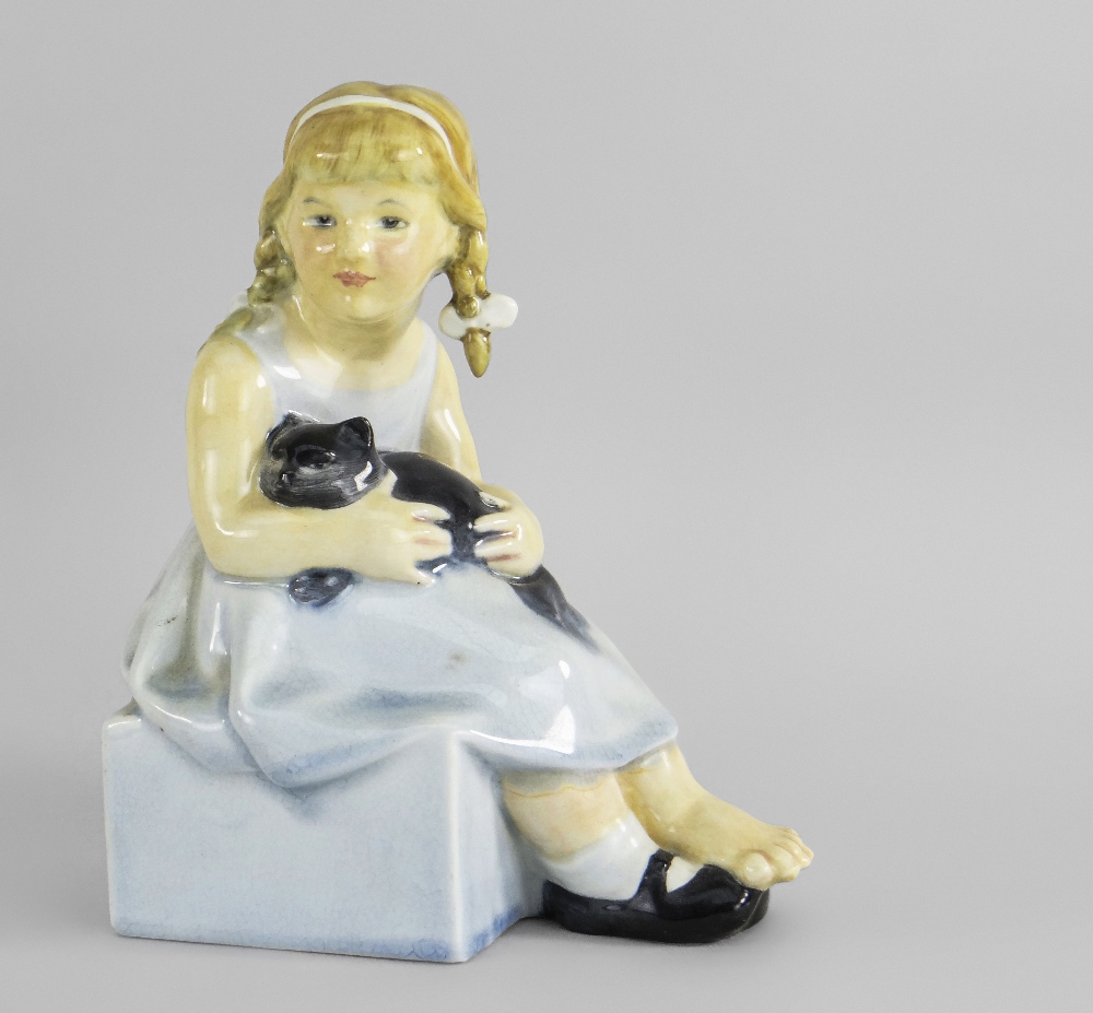 A RARE ROYAL DOULTON (BURSLEM) FIGURE OF 'PUSSY' BY F.C. STONE, modeled as a young girl with a black