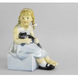 A RARE ROYAL DOULTON (BURSLEM) FIGURE OF 'PUSSY' BY F.C. STONE, modeled as a young girl with a black