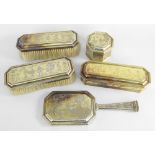 GEORGE V MATCHED FIVE-PIECE SILVER GILT DRESSING TABLE VANITY SET overall engraved in Chinoiserie