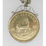 1980 1/2OZ GOLD KRUGERRAND IN 9CT GOLD MOUNT on 9ct gold chain. 27 grams overall. Condition