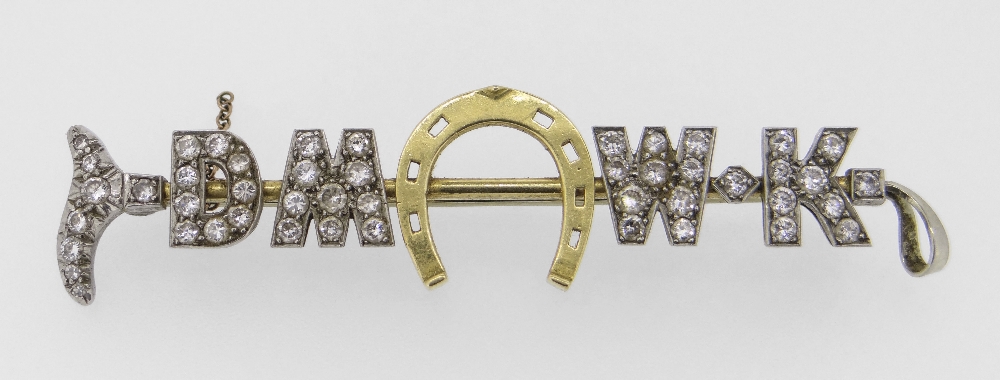 YELLOW & WHITE METAL DIAMOND ENCRUSTED BAR BROOCH in the form of a riding crop and horseshoe. The 47