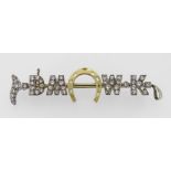 YELLOW & WHITE METAL DIAMOND ENCRUSTED BAR BROOCH in the form of a riding crop and horseshoe. The 47