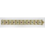 14K YELLOW GOLD SCROLL AND FLORAL TABLET BRACELET, each tablet with alternating rubies and green