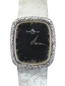 18CT WHITE GOLD (750) BAUME & MERCIER WRISTWATCH having diamond set bezel and integrated strap, 47.4