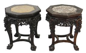 MATCHED PAIR OF CHINESE CARVED HARDWOOD OCTAGONAL STANDS, the tops with inset marble on four