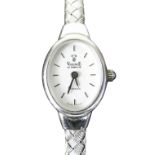 14K WHITE GOLD LADIES VICENCE WRISTWATCH HAVING OVAL DIAL and integrated 14k white gold bracelet.