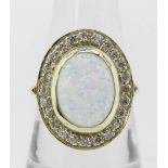 14K (585) YELLOW GOLD OVAL OPAL DRESS RING having border of twenty-four small diamonds, 6.8 grams.