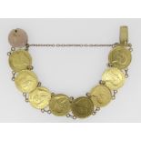 GOLD COIN BRACELET comprising 8 gold South African 1/2 pond 1897 coins, the clasp engraved '