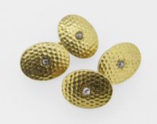 PAIR OF 18CT YELLOW GOLD AND DIAMOND CUFFLINKS of hammered design, 17.7 grams overall. Condition