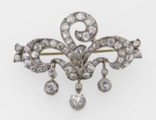 YELLOW & WHITE METAL DIAMOND ENCRUSTED THREE SCROLL BROOCH having three diamond drops in original