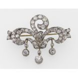 YELLOW & WHITE METAL DIAMOND ENCRUSTED THREE SCROLL BROOCH having three diamond drops in original