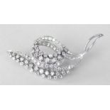 WHITE METAL DIAMOND ENCRUSTED LEAF AND SCROLL DESIGN BROOCH, 6.4cms at widest point, 12.9 grams.